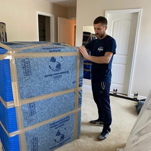 man moving box