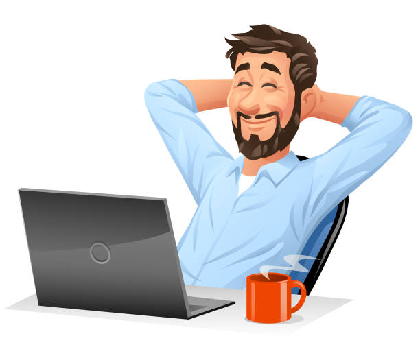 Young Man At Computer Leaned Back In His Chair